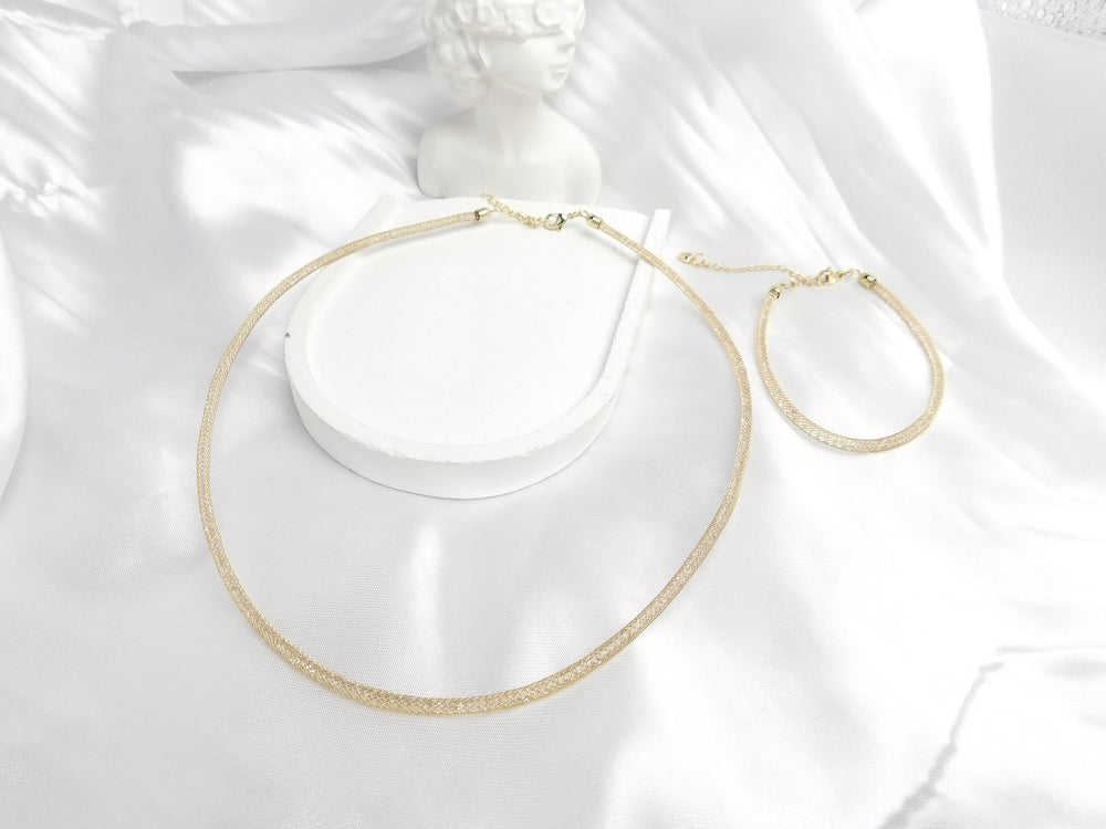 Collar y pulsera Couture dorado